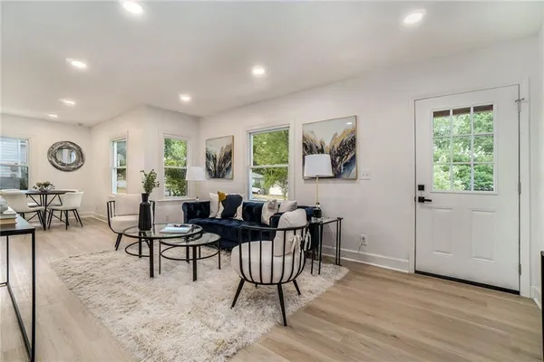 a view of a livingroom with furniture and window