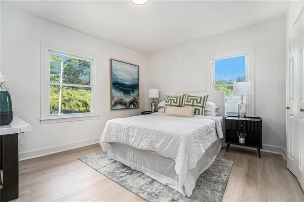 a bedroom with a bed and window