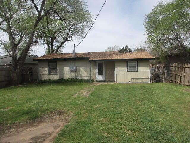 4109 South Bowie Street Amarillo, TX 79110 - Photo 11 of 13 a front view of a house with a garden
