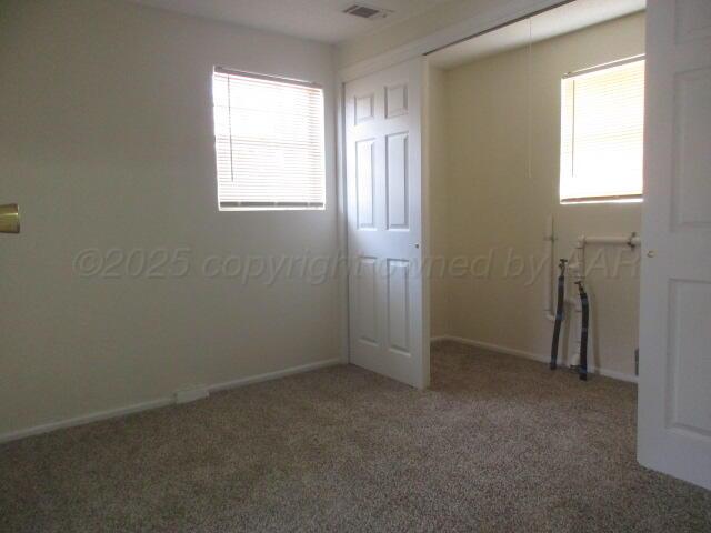 4109 South Bowie Street Amarillo, TX 79110 - Photo 2 of 13 an empty room with windows