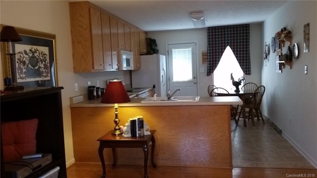 2032 Cansler Road Vale, NC 28168 - Photo 5 of 15 a view of a kitchen area with furniture and wooden floor