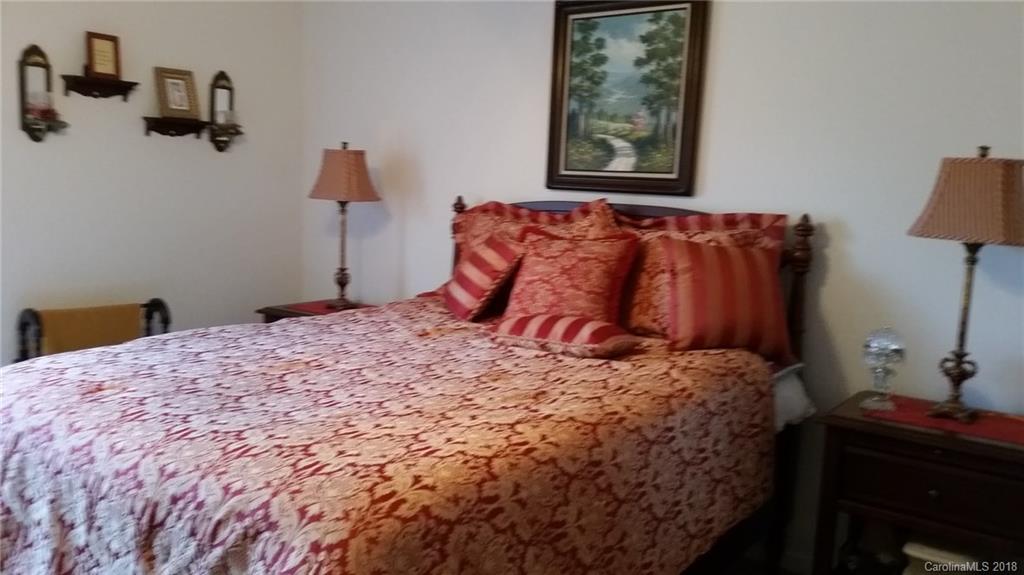 2032 Cansler Road Vale, NC 28168 - Photo 9 of 15 a bedroom with a bed and a lamp on dresser