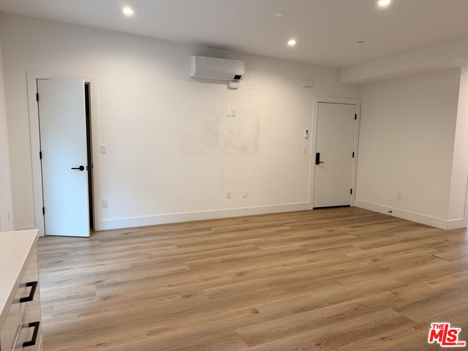 914 7th Street, Unit 9 Santa Monica, CA 90403 - Photo 3 of 9 a view of an empty room with wooden floor
