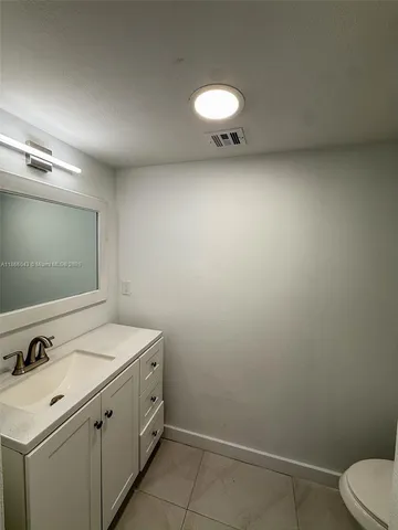 a view of a storage & utility room with a sink