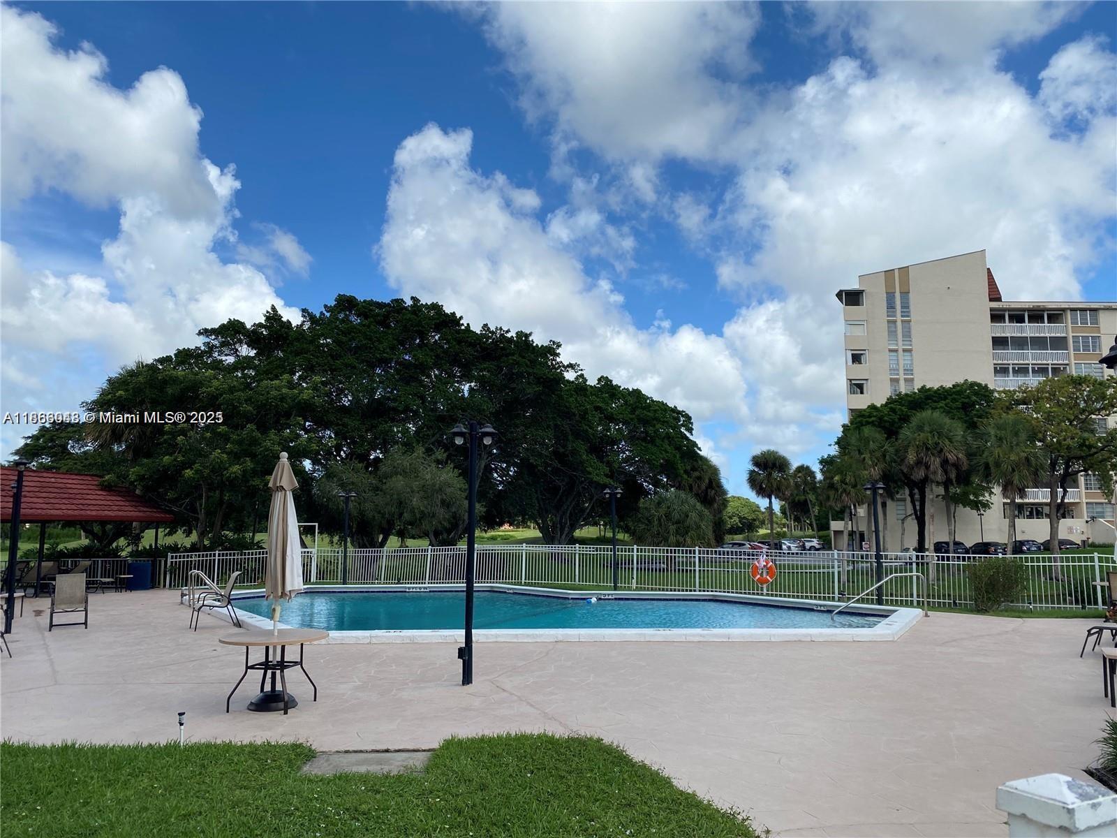 7051 Environ Boulevard, Unit 431 Lauderhill, FL 33319 - Photo 3 of 35 a park view with a bench