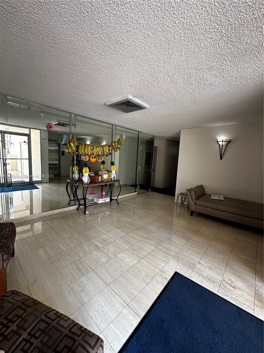 7051 Environ Boulevard, Unit 431 Lauderhill, FL 33319 - Photo 33 of 35 a living room with furniture