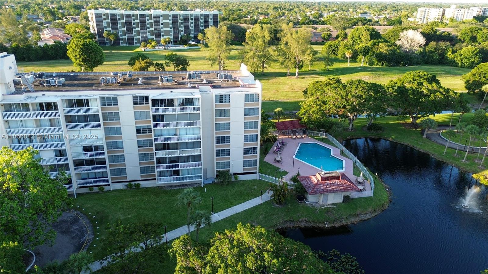 7051 Environ Boulevard, Unit 431 Lauderhill, FL 33319 - Photo 8 of 35 an aerial view of a house with a garden and lake view