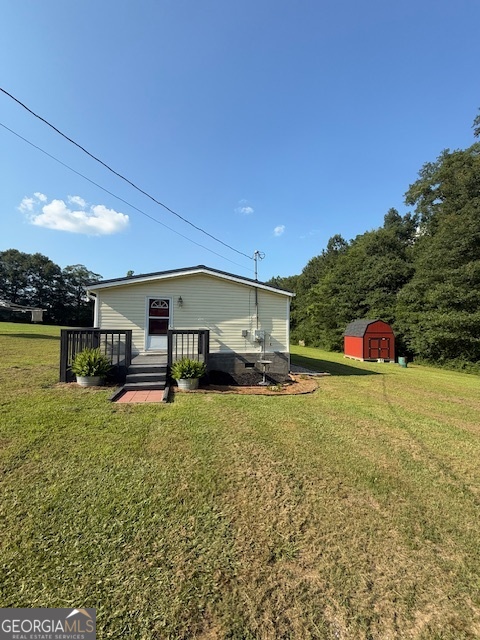 652 Duncan Road Carrollton, GA 30116 - Photo 1 of 1 a view of a house with backyard and trees
