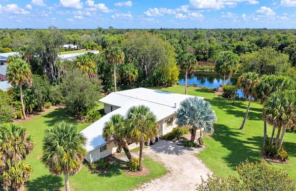 a view of a garden with a building in the background