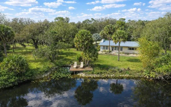aerial view of a house with a yard