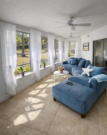 a bedroom with a bed and windows