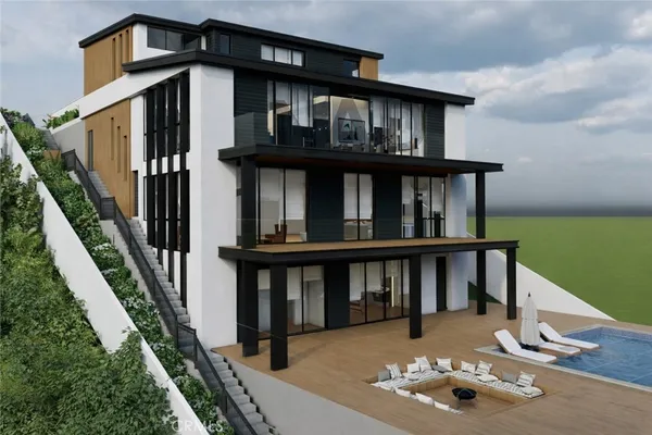 a view of a house with backyard and deck