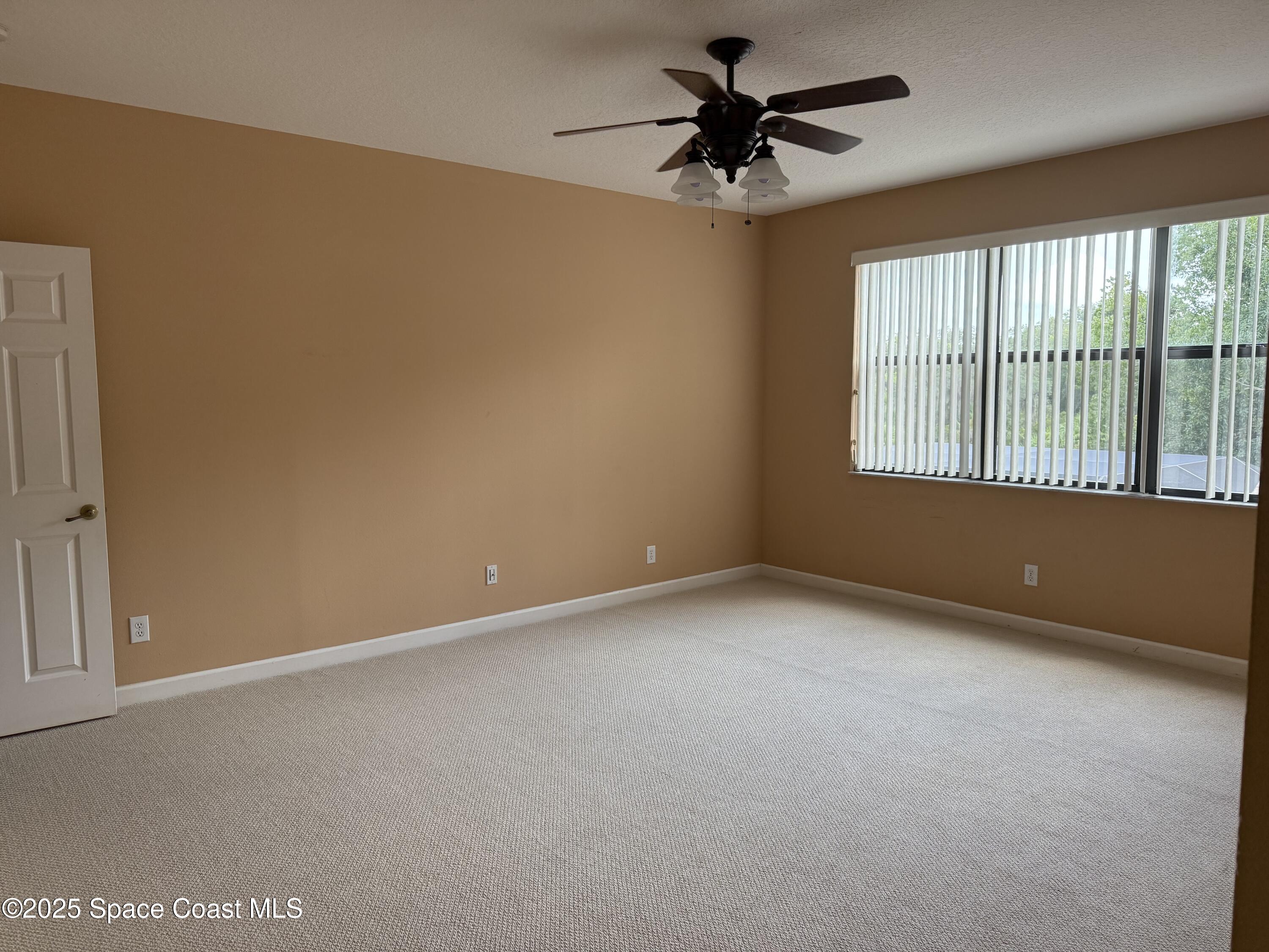 1777 Sienna Drive Melbourne, FL 32934 - Photo 18 of 31 an empty room with a window