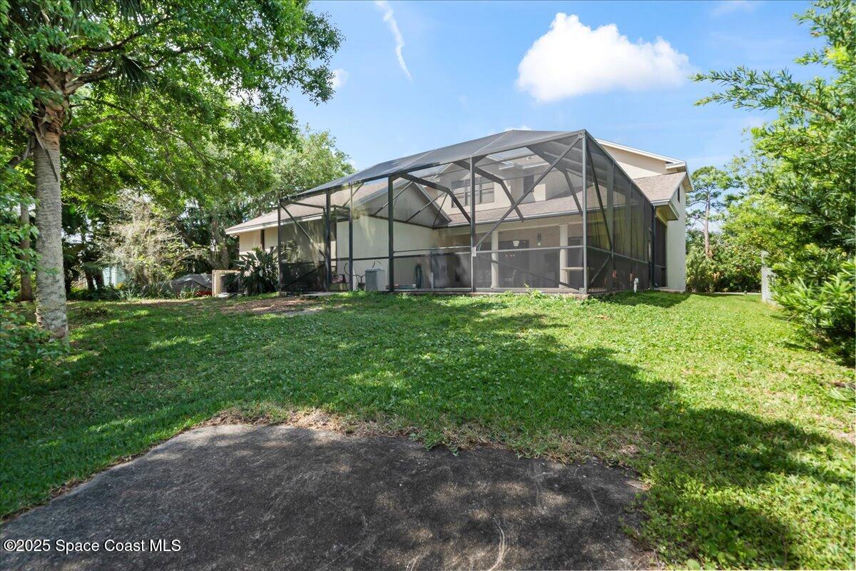 1777 Sienna Drive Melbourne, FL 32934 - Photo 24 of 31 a view of a house with a yard