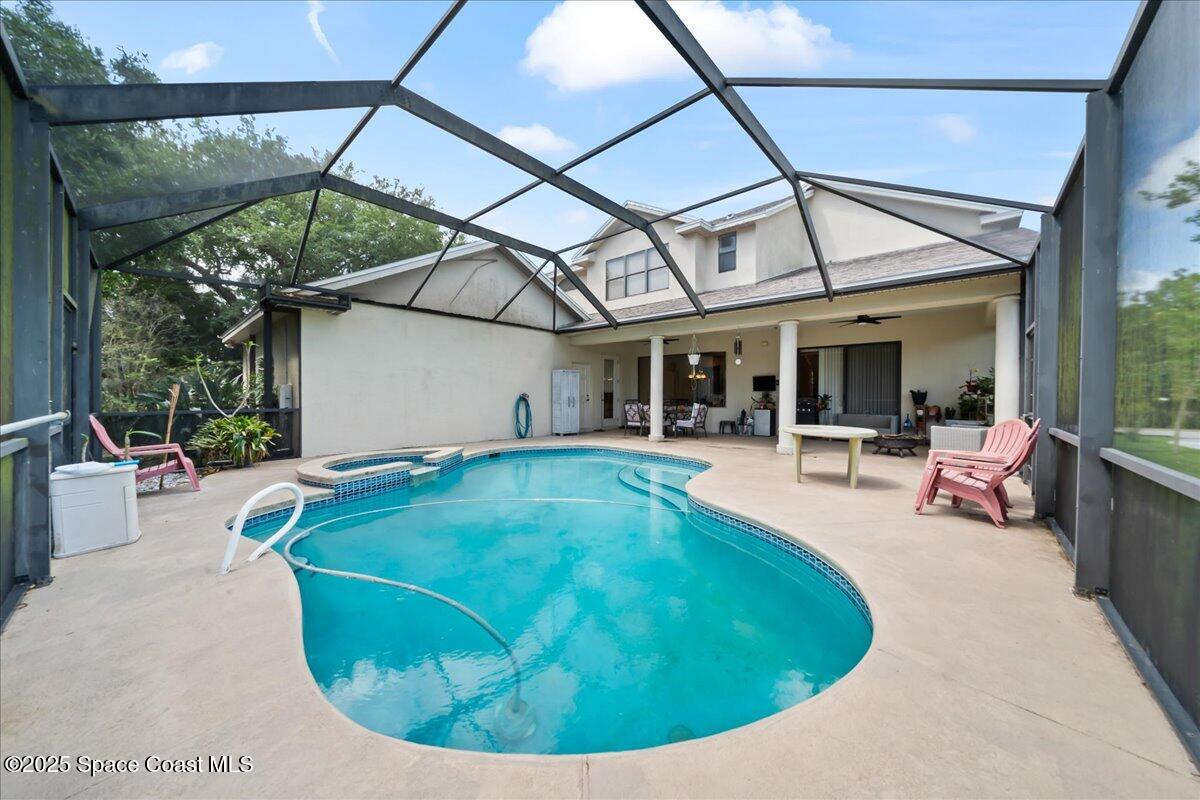 1777 Sienna Drive Melbourne, FL 32934 - Photo 3 of 31 a view of a swimming pool with a patio