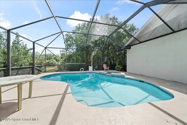 a view of a swimming pool with a porch