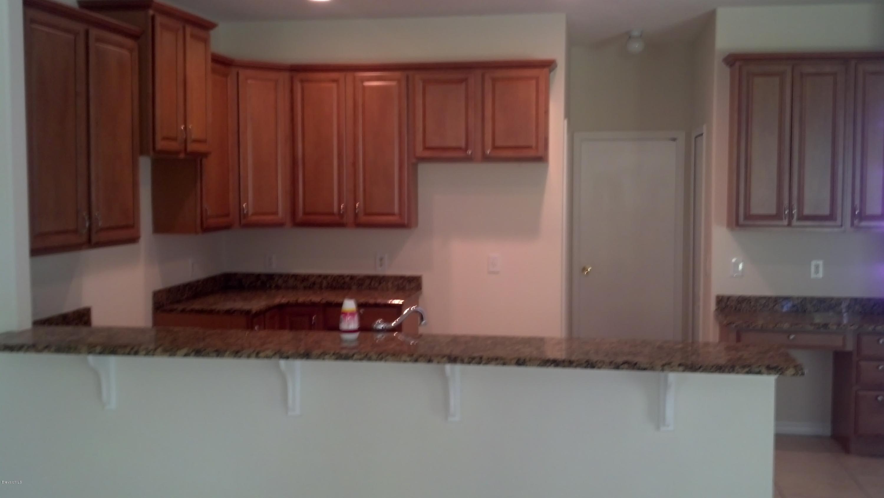 1401 Hanscom Road Southwest Palm Bay, FL 32908 - Photo 5 of 12 HANSCOM KITCHEN 2
