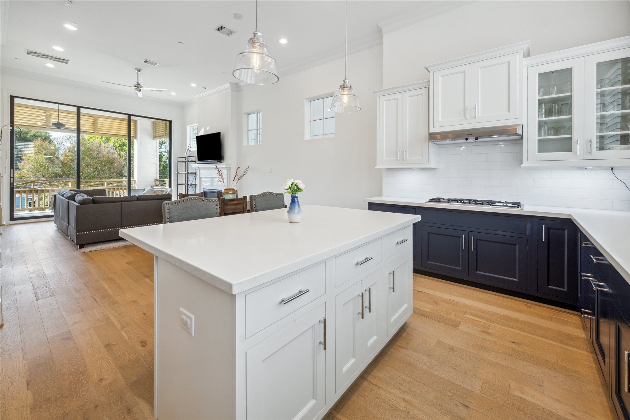 2714 Harvard Street Houston, TX 77008 - Photo 12 of 32 a kitchen with stainless steel appliances a sink a stove and a refrigerator with wooden floor