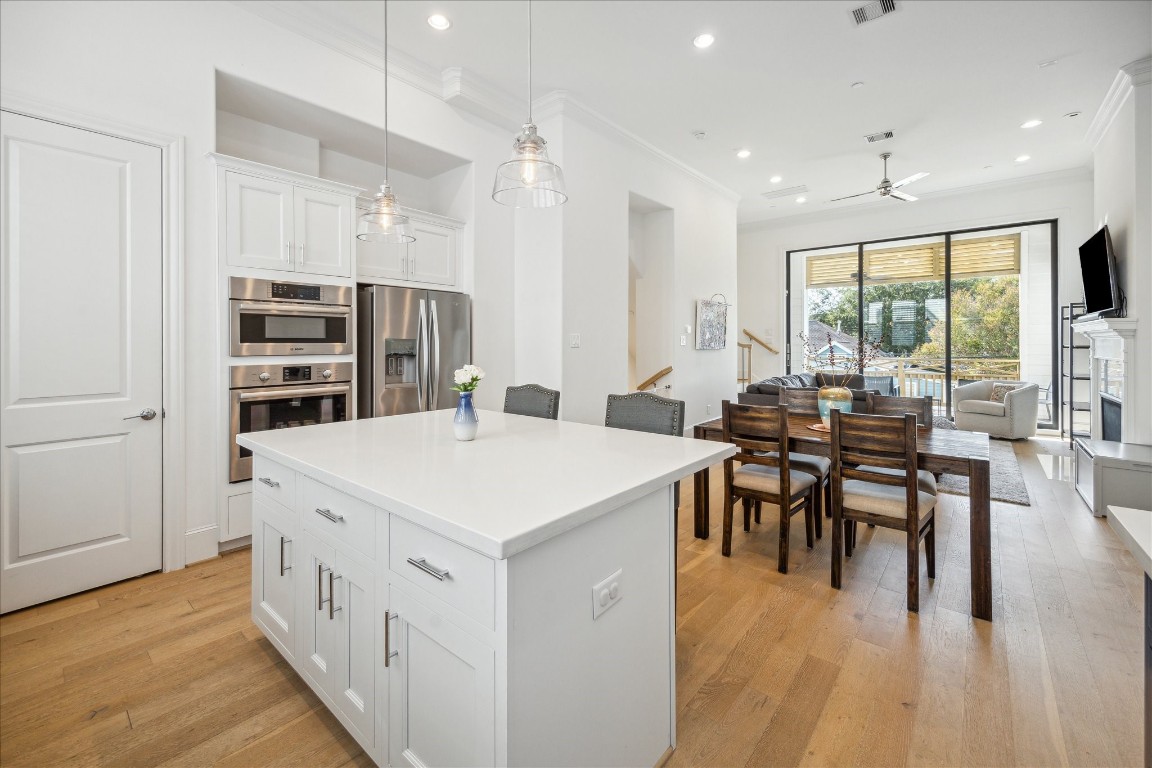 2714 Harvard Street Houston, TX 77008 - Photo 13 of 32 a large kitchen with kitchen island a large island in it