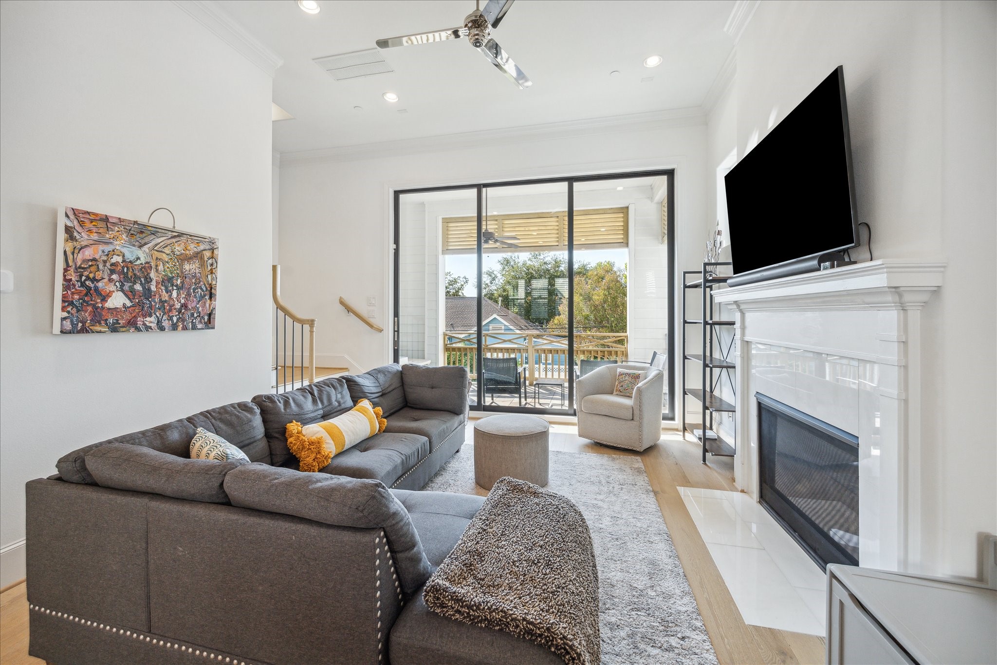 2714 Harvard Street Houston, TX 77008 - Photo 17 of 32 a living room with furniture a fireplace and a flat screen tv