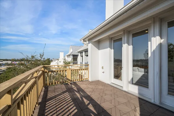 a view of balcony with furniture