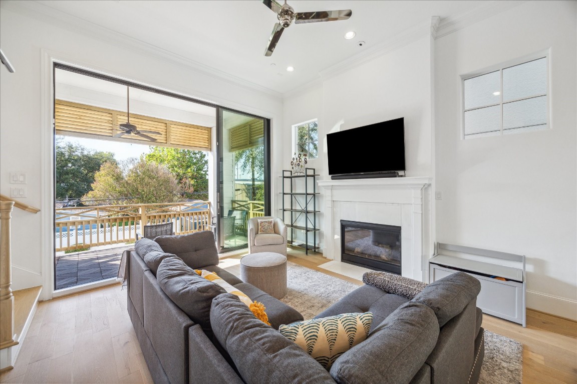 2714 Harvard Street Houston, TX 77008 - Photo 5 of 32 a living room with furniture a fireplace and a flat screen tv