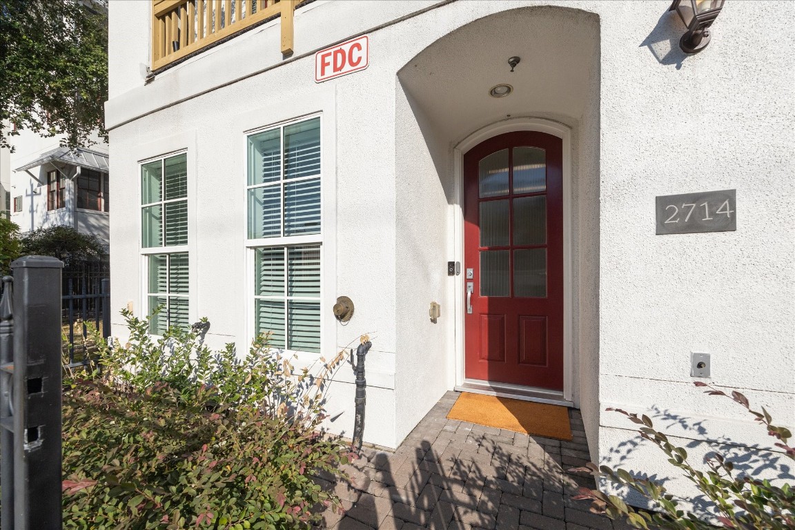 2714 Harvard Street Houston, TX 77008 - Photo 6 of 32 a front view of a house with large windows