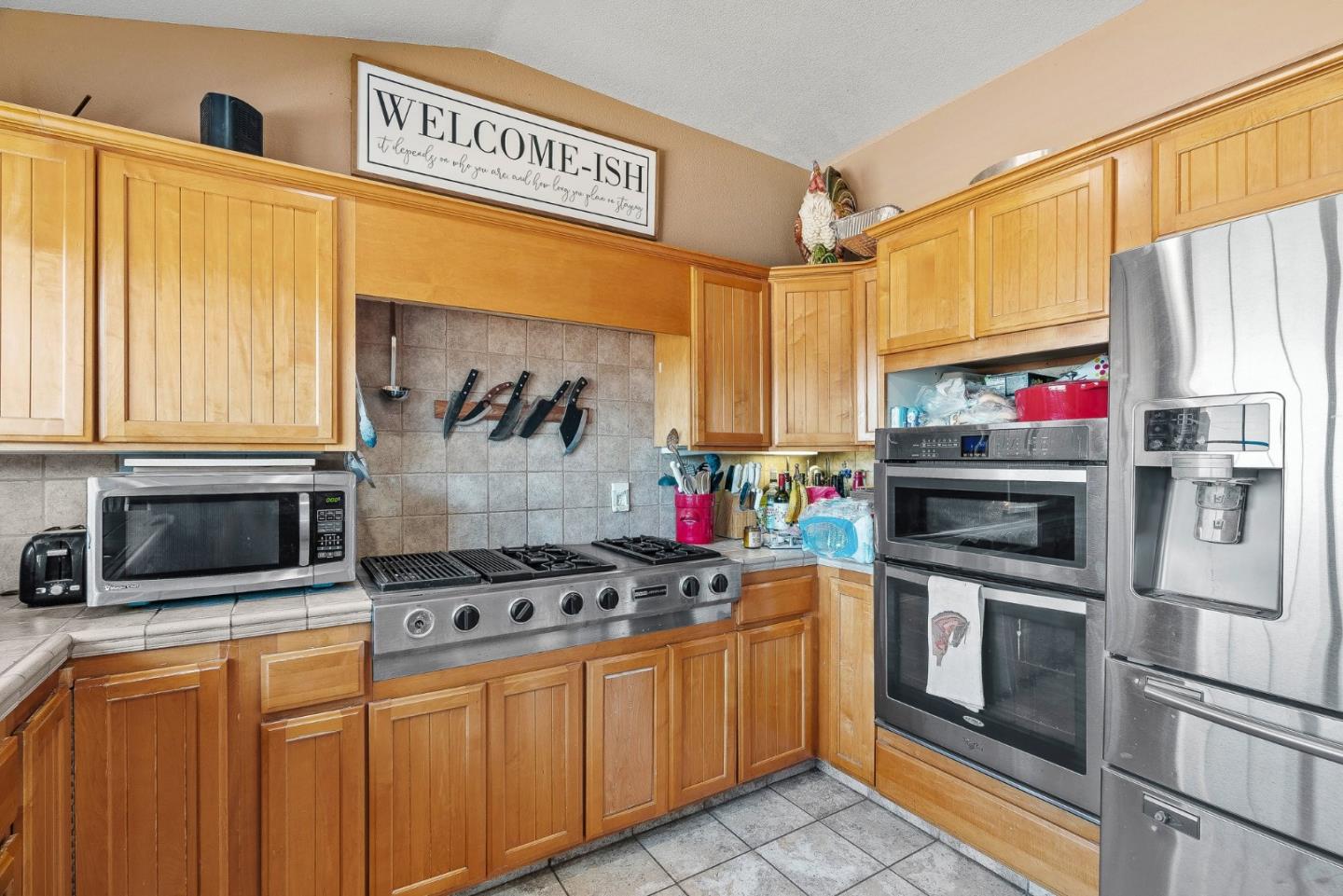 350 San Benancio Road Salinas, CA 93908 - Photo 46 of 68 a kitchen with stainless steel appliances a stove a sink and a refrigerator