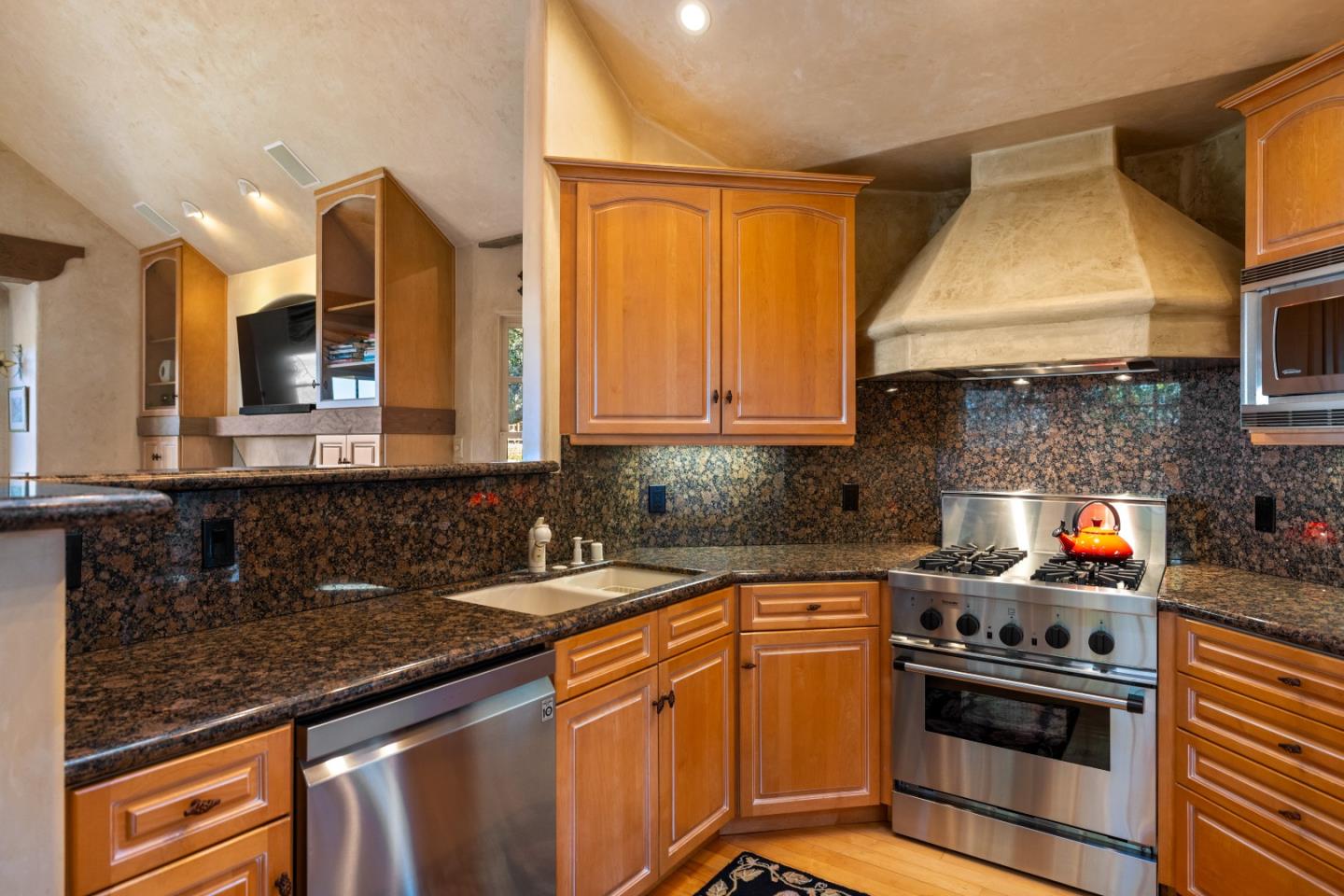 3 Santa Fe Street Carmel, CA 93923 - Photo 17 of 72 a kitchen with stainless steel appliances granite countertop a stove and a sink
