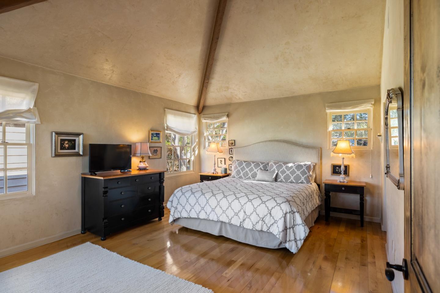 3 Santa Fe Street Carmel, CA 93923 - Photo 26 of 72 a bedroom with a bed and a flat screen tv