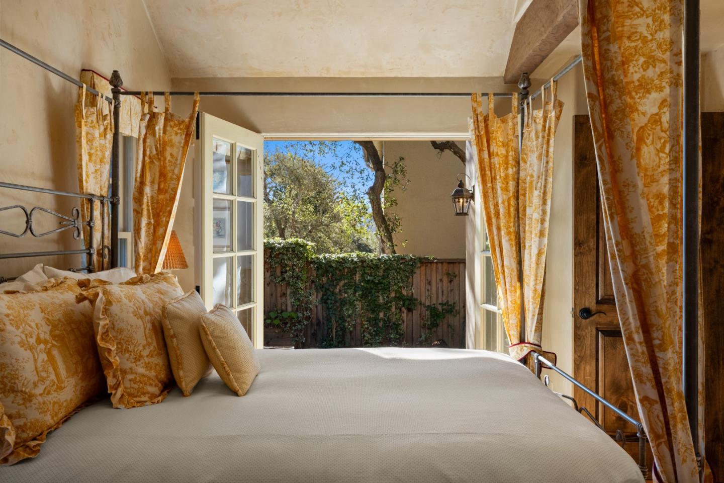 3 Santa Fe Street Carmel, CA 93923 - Photo 39 of 72 a bedroom with a bed and a window