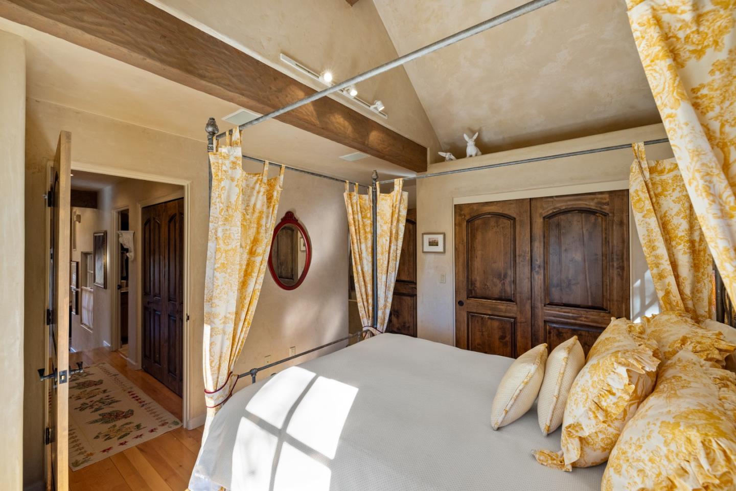 3 Santa Fe Street Carmel, CA 93923 - Photo 41 of 72 a bedroom with a bed and a mirror