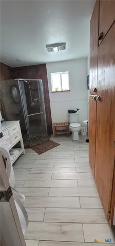 a living room with furniture and a toilet