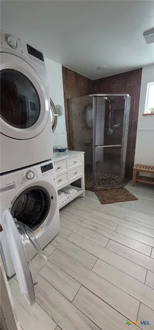 a view of a storage and utility room in empty room