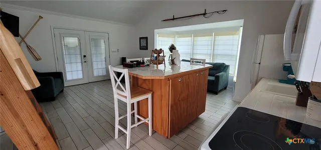 a kitchen with a sink appliances and cabinets