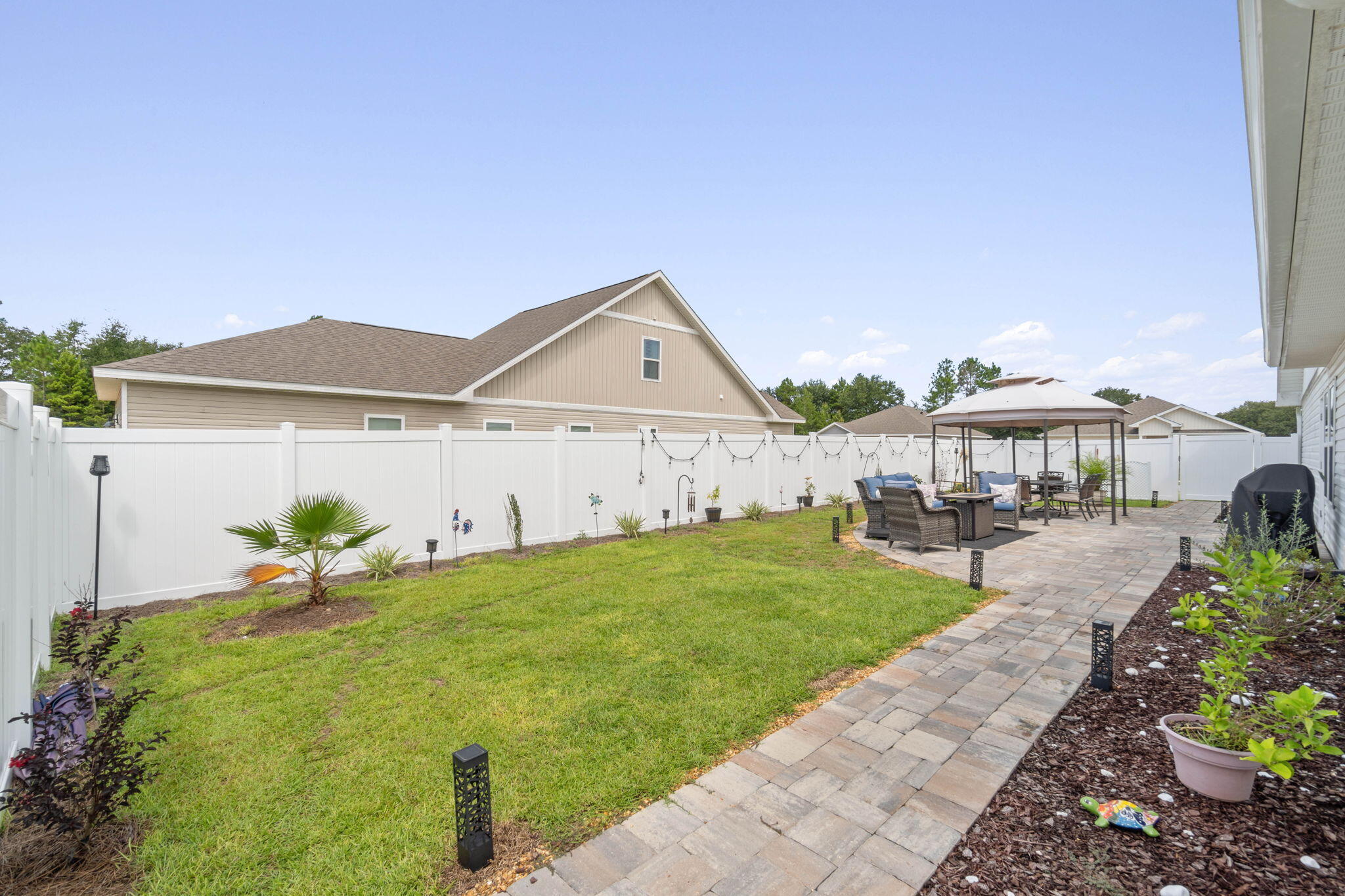 38 Silverthorn Street Freeport, FL 32439 - Photo 3 of 42 a front view of a house with garden