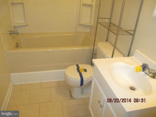 743 Lazy River Road Lusby, MD 20657 - Photo 16 of 16 a bathroom with a sink and bathtub