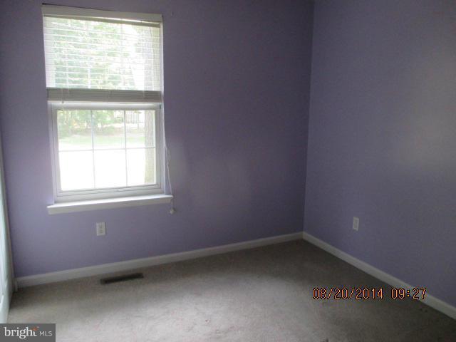743 Lazy River Road Lusby, MD 20657 - Photo 4 of 16 an empty room with a window