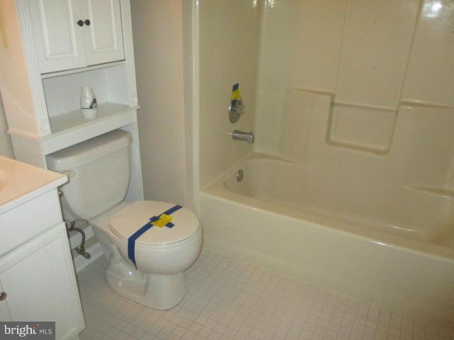 743 Lazy River Road Lusby, MD 20657 - Photo 5 of 16 a bathroom with a sink a toilet and shower