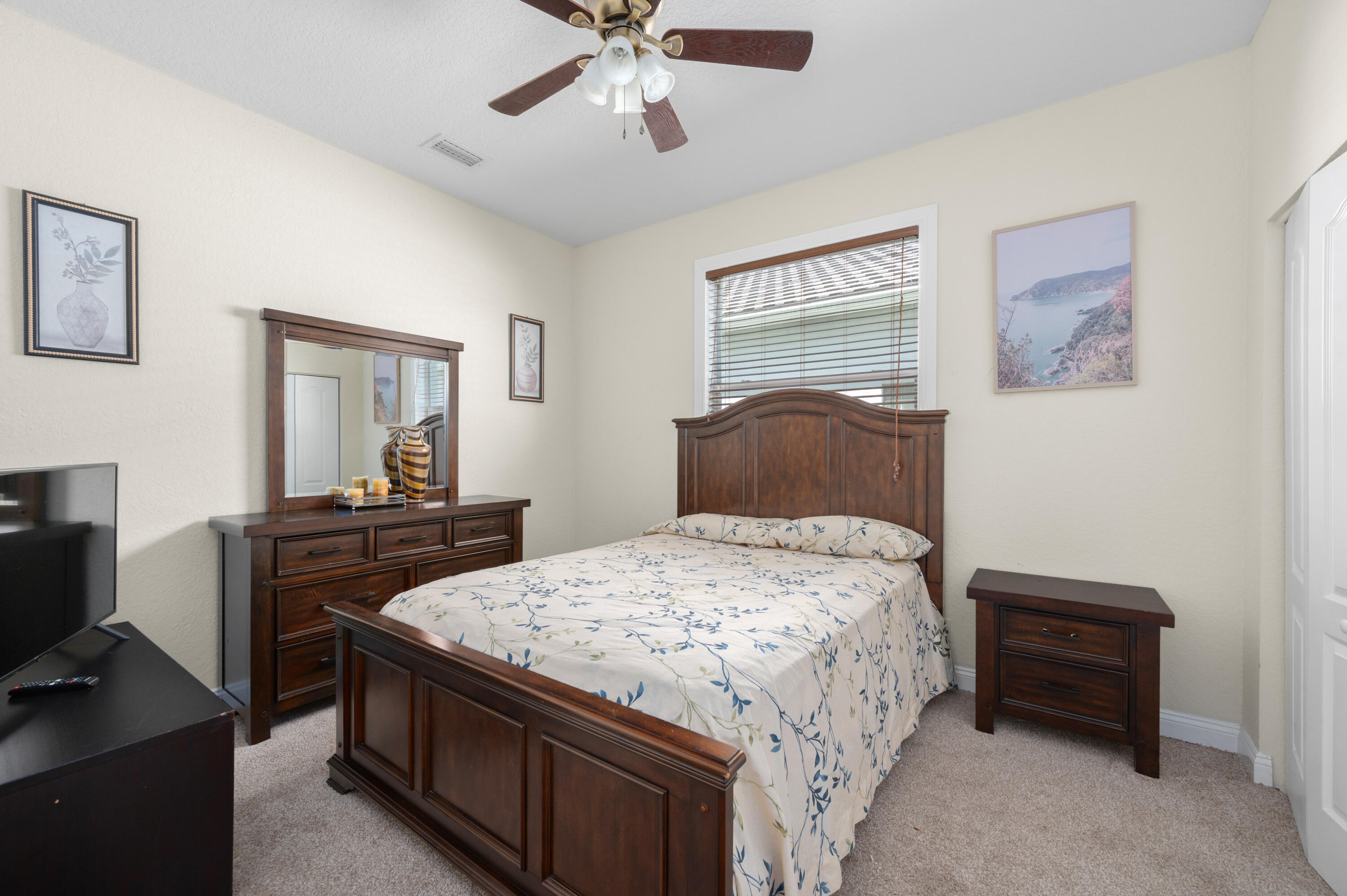 311 Berenger Walk Royal Palm Beach, FL 33414 - Photo 13 of 34 a bedroom with a bed and a desk