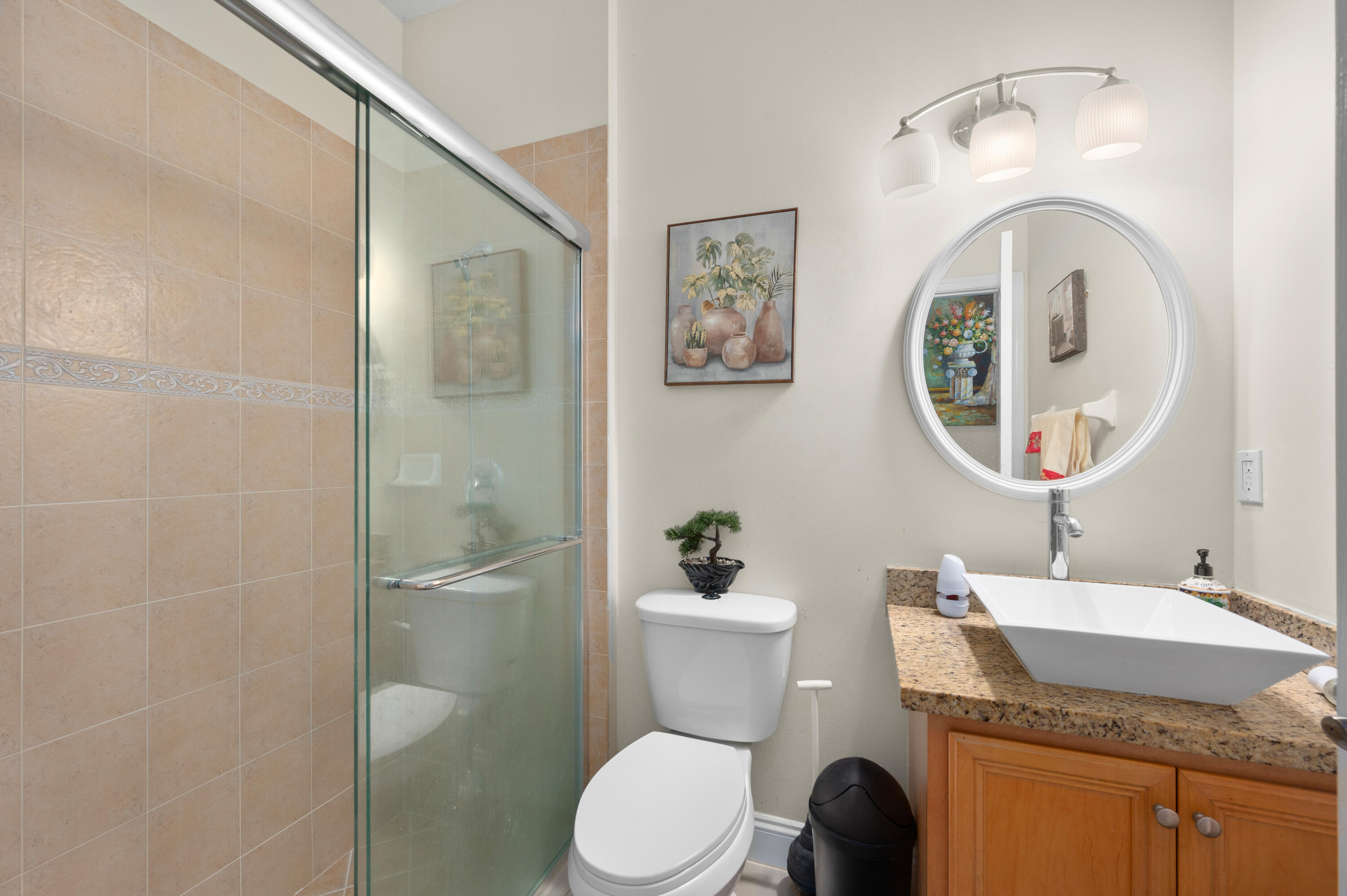 311 Berenger Walk Royal Palm Beach, FL 33414 - Photo 14 of 34 a bathroom with a granite countertop toilet sink and mirror