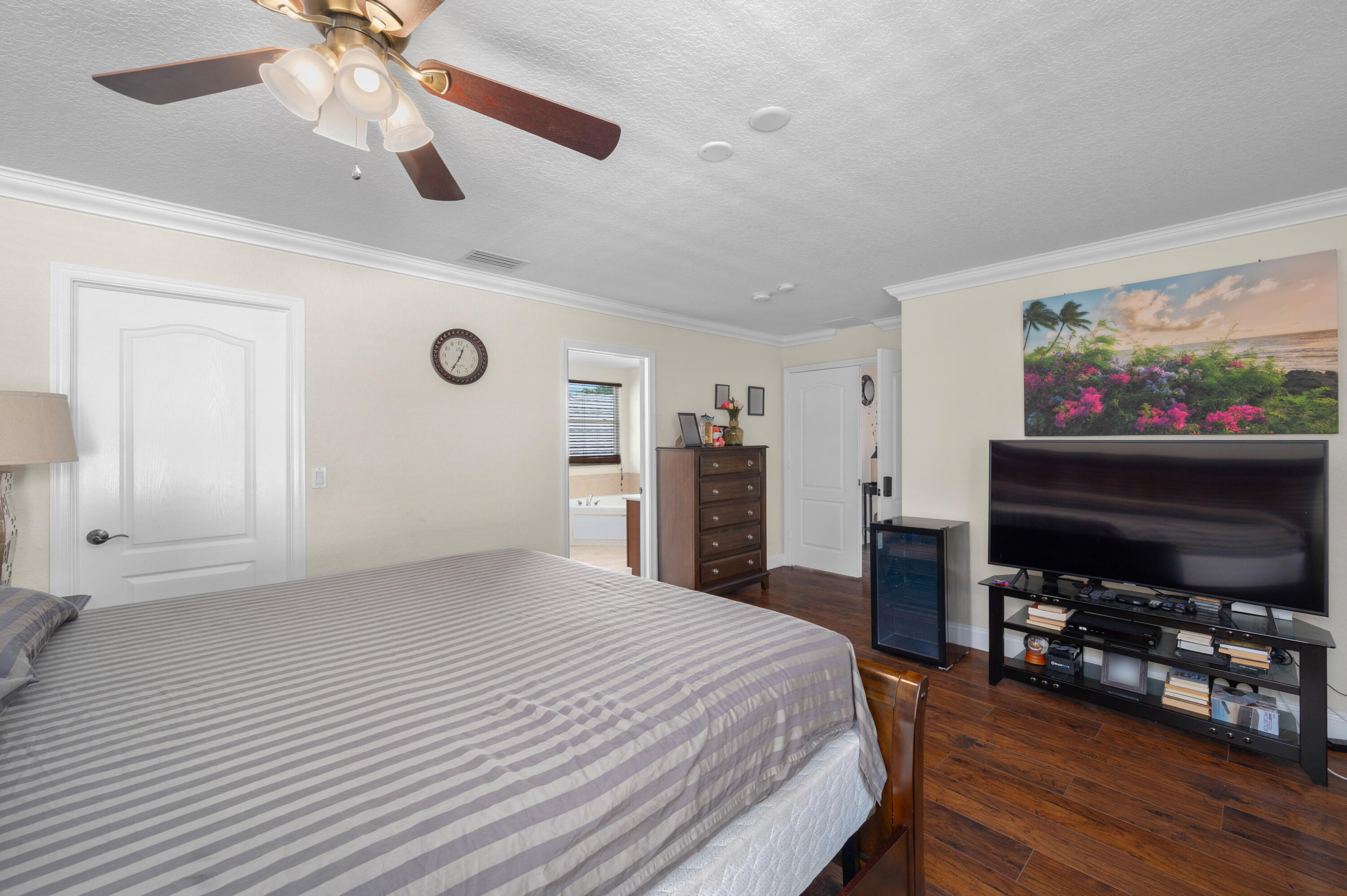 311 Berenger Walk Royal Palm Beach, FL 33414 - Photo 24 of 34 a bedroom with a bed and a flat screen tv