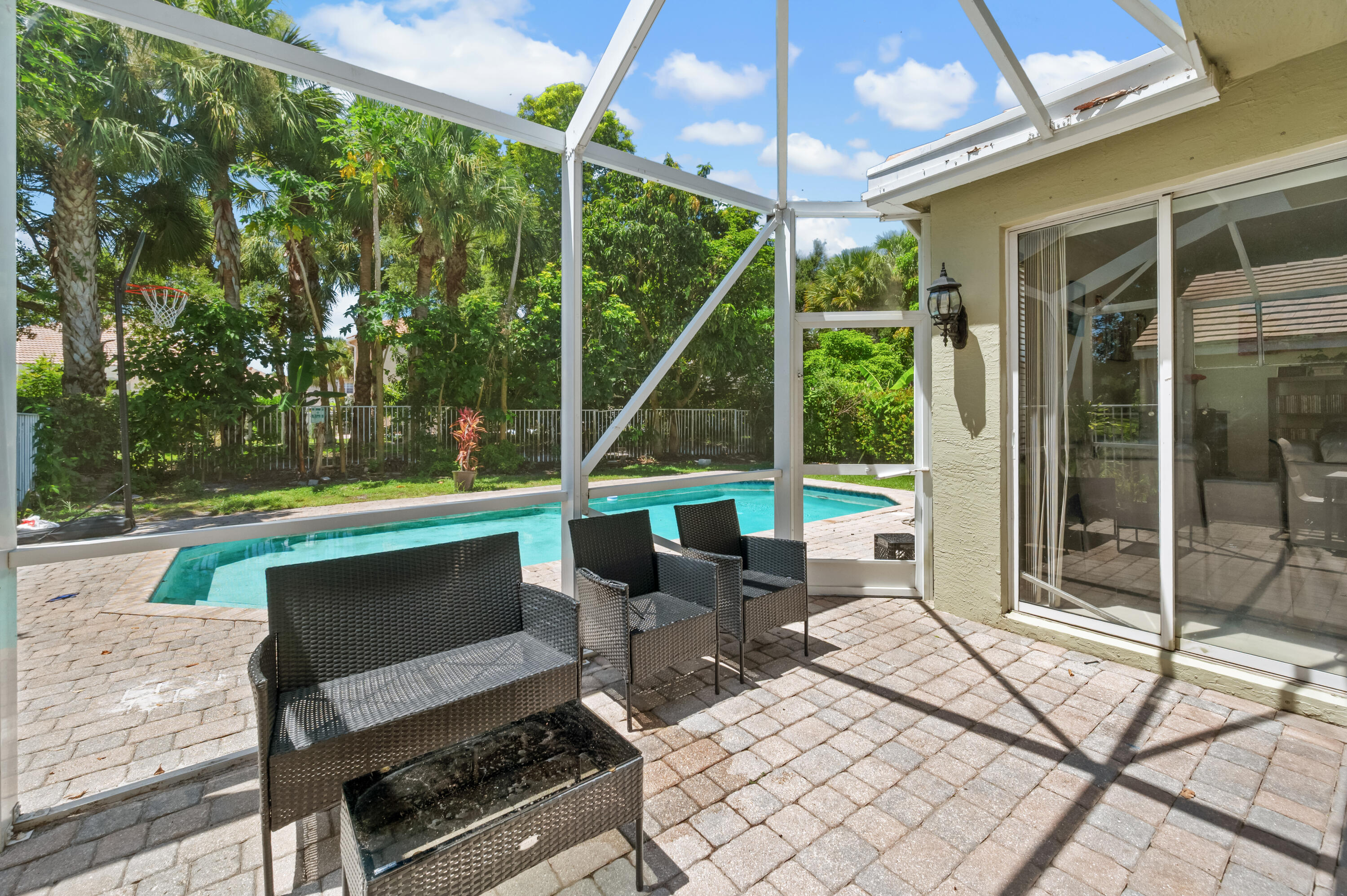 311 Berenger Walk Royal Palm Beach, FL 33414 - Photo 29 of 34 a view of a two chairs in the patio