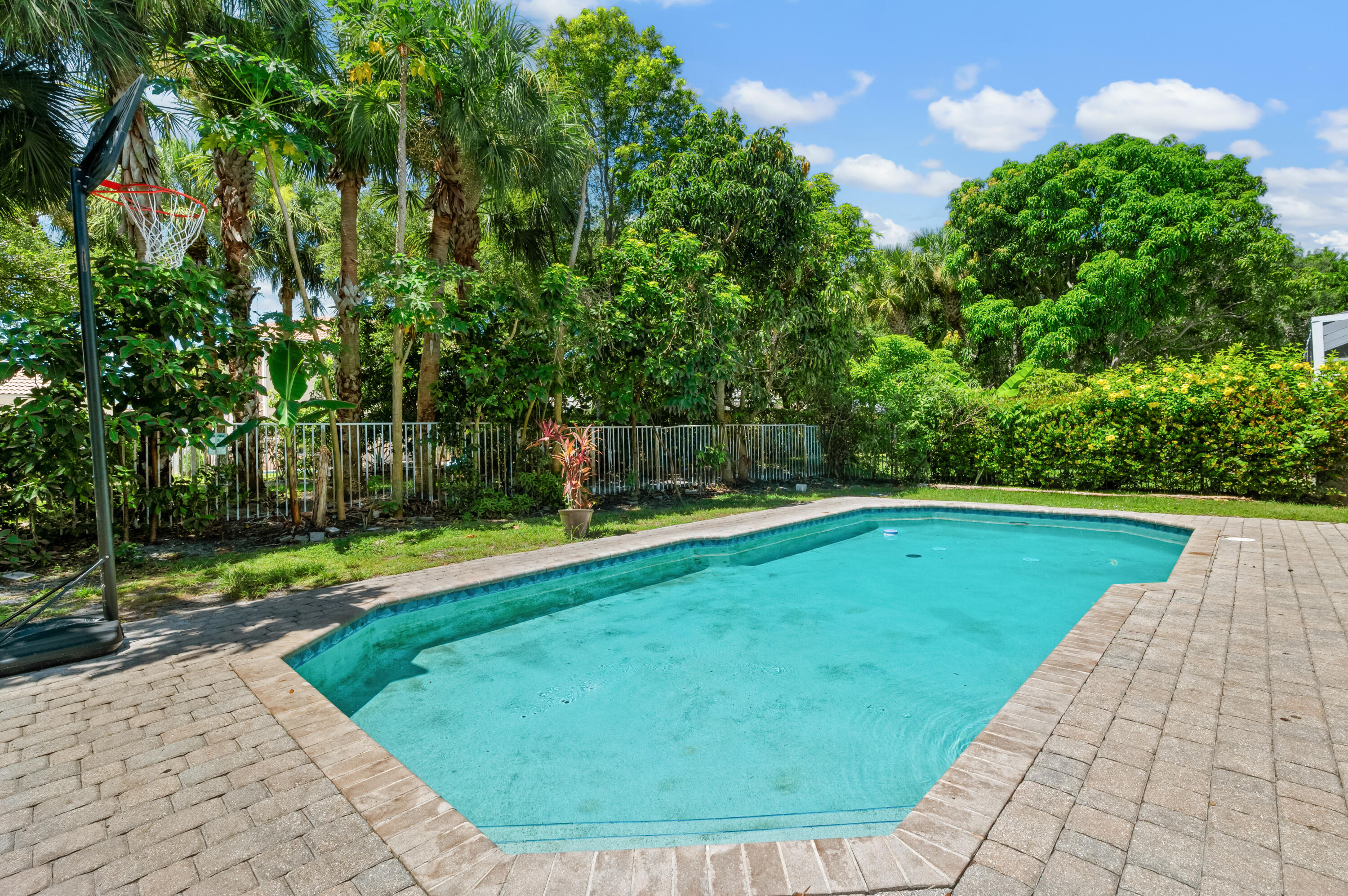 311 Berenger Walk Royal Palm Beach, FL 33414 - Photo 30 of 34 a view of a swimming pool with a yard