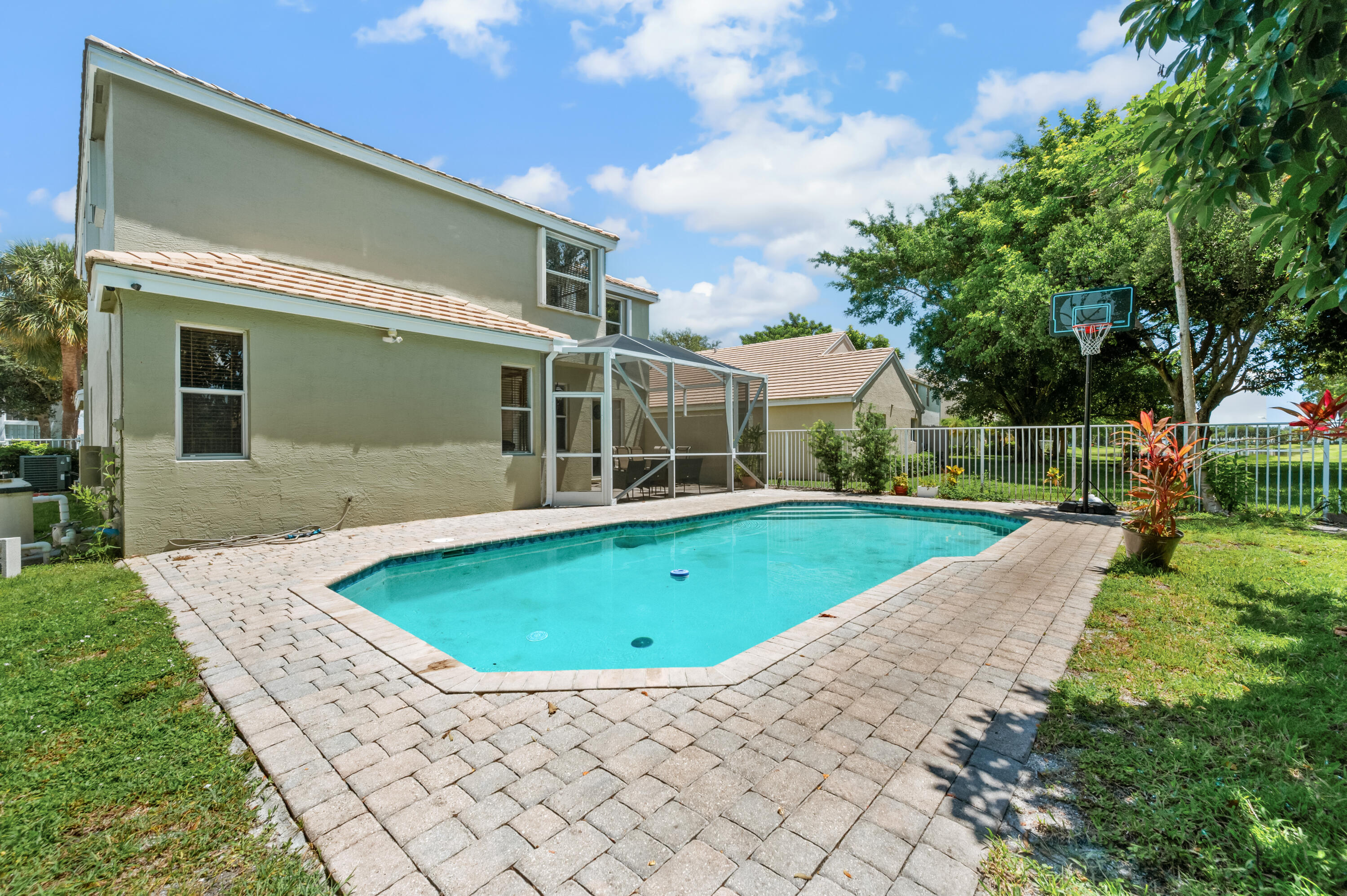 311 Berenger Walk Royal Palm Beach, FL 33414 - Photo 31 of 34 a view of outdoor space yard swimming pool and porch