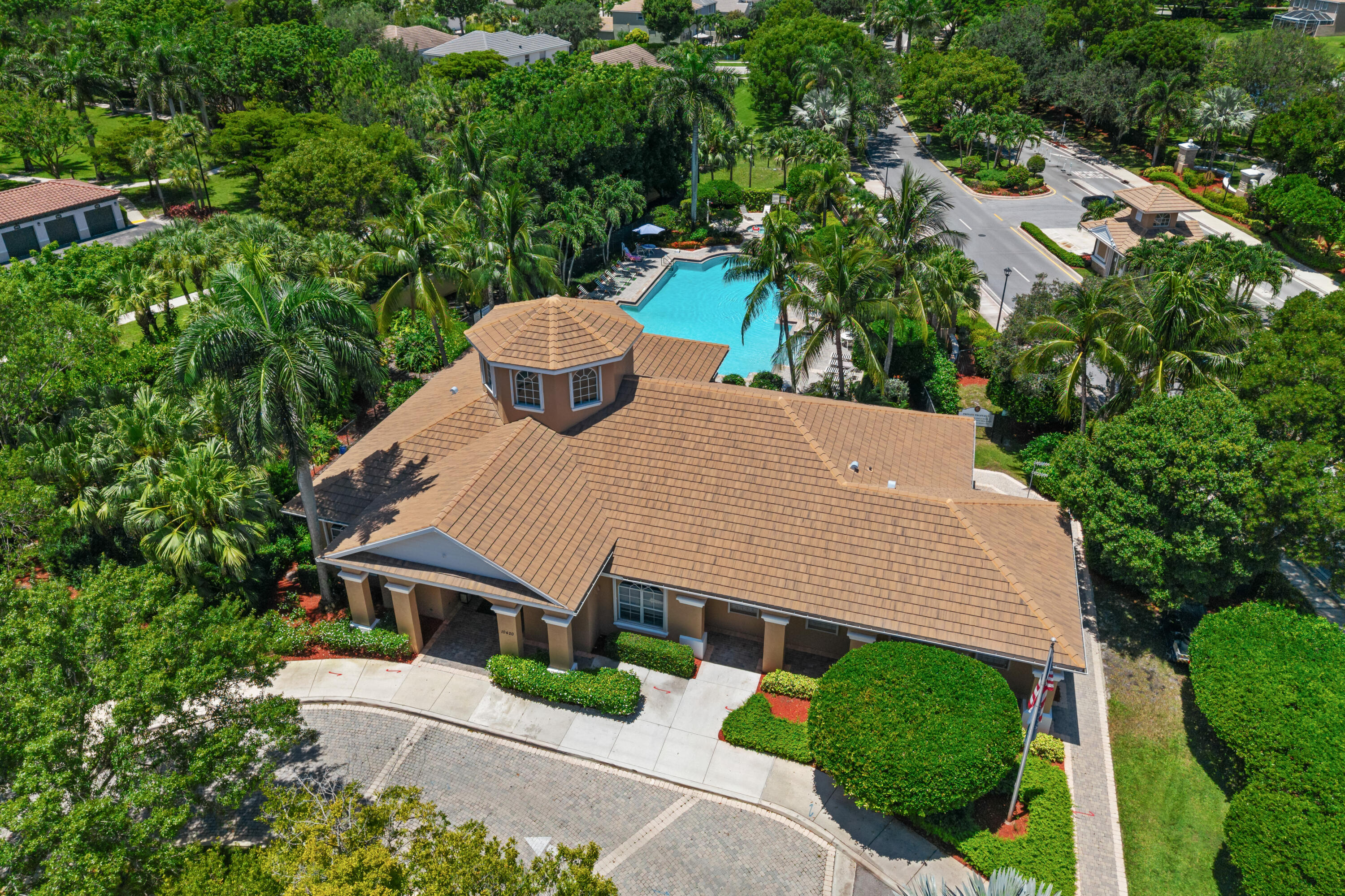 311 Berenger Walk Royal Palm Beach, FL 33414 - Photo 32 of 34 an aerial view of a house with a yard and large trees