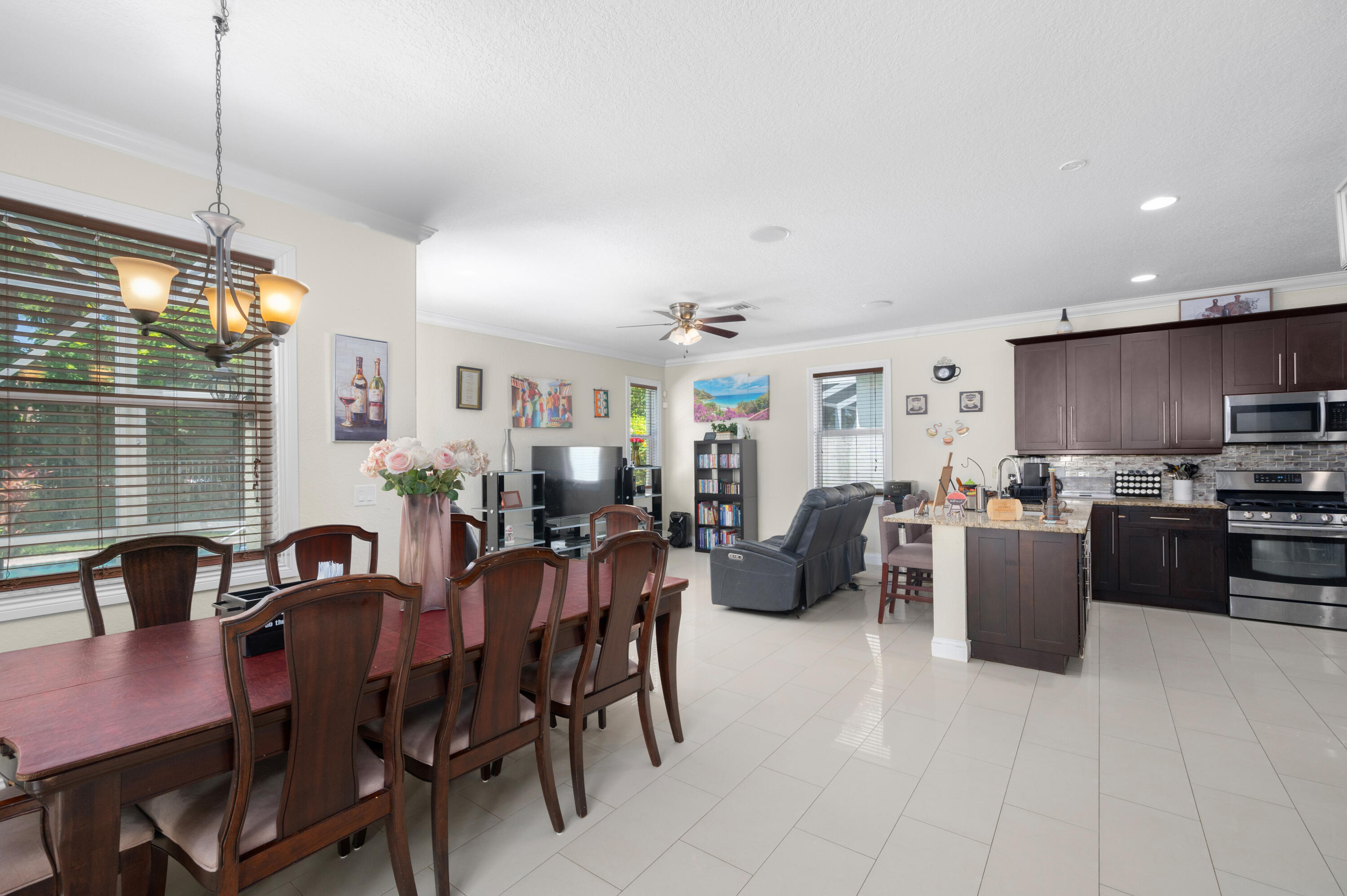 311 Berenger Walk Royal Palm Beach, FL 33414 - Photo 6 of 34 a view of a dining room with furniture