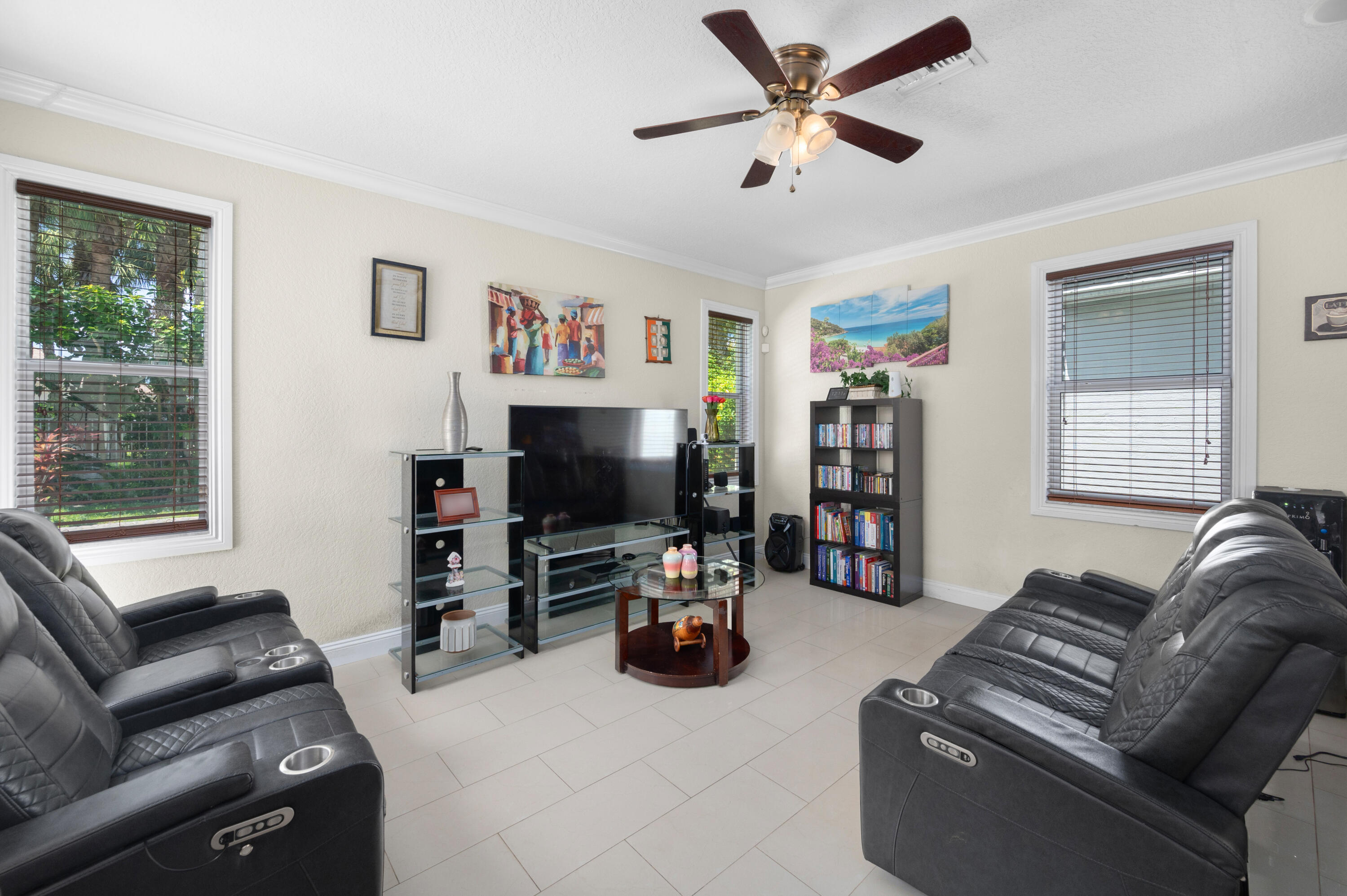 311 Berenger Walk Royal Palm Beach, FL 33414 - Photo 10 of 34 a living room with furniture and a flat screen tv