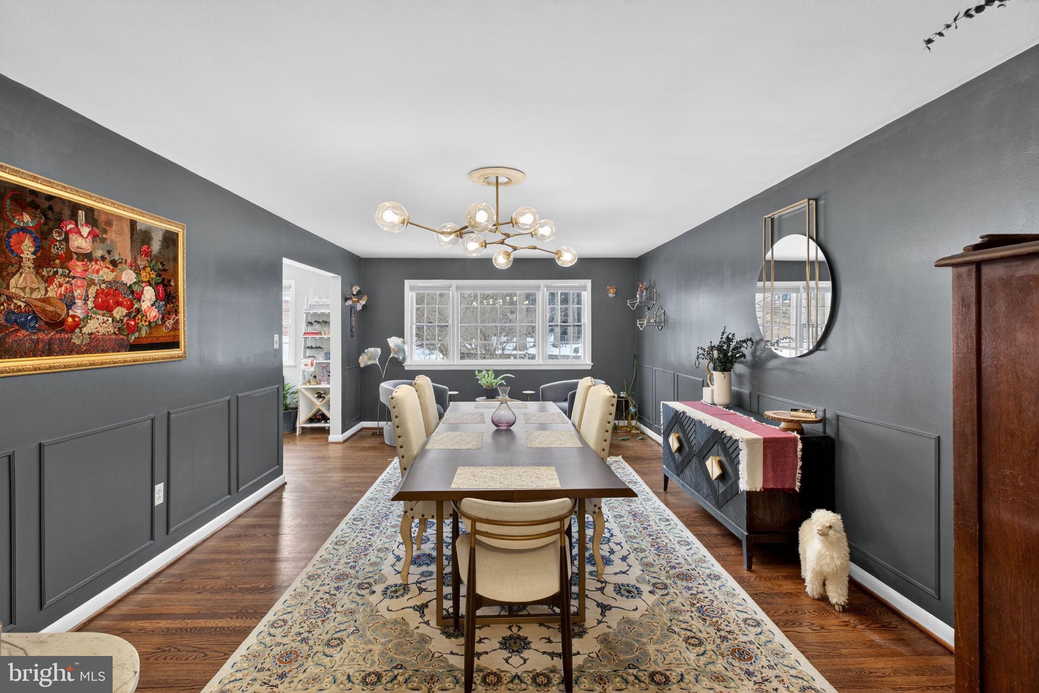 2849 Hideaway Road Fairfax, VA 22031 - Photo 11 of 45 a living room with furniture a rug and a chandelier