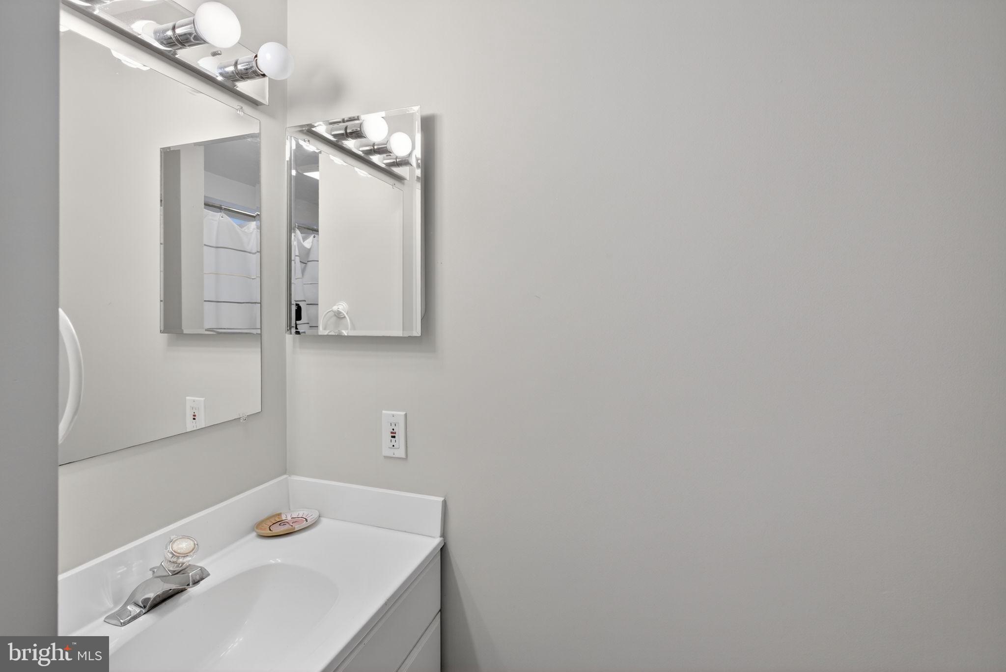 2849 Hideaway Road Fairfax, VA 22031 - Photo 15 of 45 a bathroom with a sink vanity and mirror